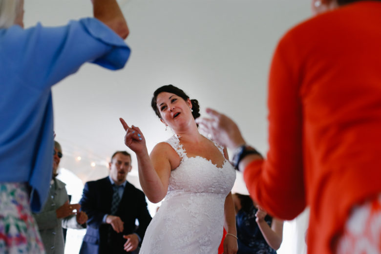 Bride in center of dance circle at reception