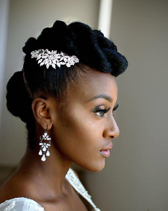 woman's profile with hair in a faux-hawk twist, accented with jeweled hairpiece